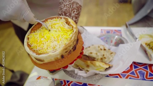 Hyderabadi Chicken Dum Biryani - marinated chicken leg cooked with basmati rice and biryani spices.