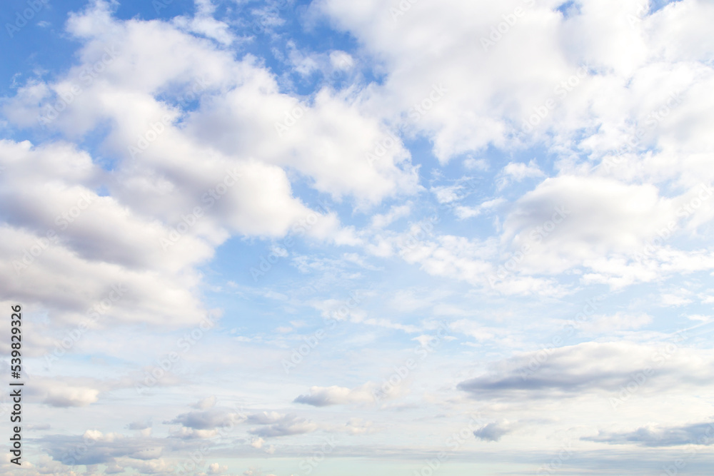 Beautiful epic soft gentle blue sky with white cirrus and fluffy cloud in sunlight background texture Beautiful epic soft gentle blue sky with white cirrus and fluffy cloud in sunlight background texture