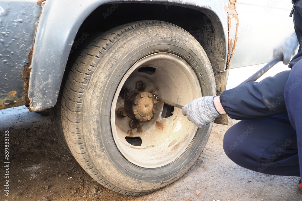 changing the wheel of a car