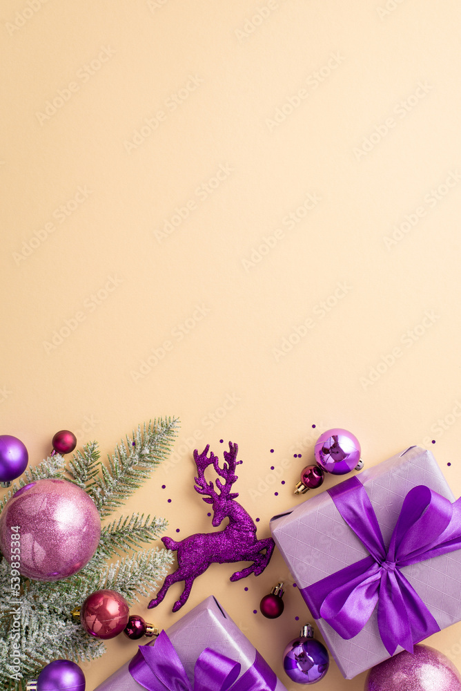 Christmas concept. Top view vertical photo of lilac present boxes with bows pink purple baubles violet deer ornament pine branch in frost confetti on isolated pastel beige background with copyspace