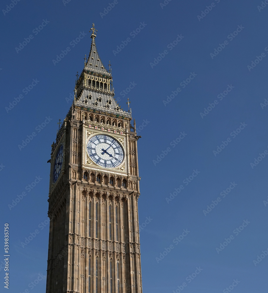 A low angle view of Big Ben, also known as the Queen Elizabeth Tower, at the Houses of Parliament in Westminster, London, UK.