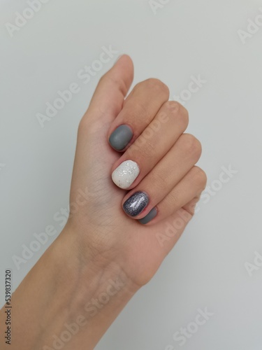 Nail polish. gel polish, manicure with a coating in a modern style. nail treatment, colored varnish. aesthetics of beauty, female grooming, salon. place for text
