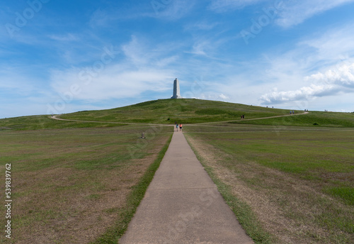 Wright Brothers Monument atop Kill Devil Hill honors the Wright brothers and mark the site of first flight. Grass stabilizes sand dune. 