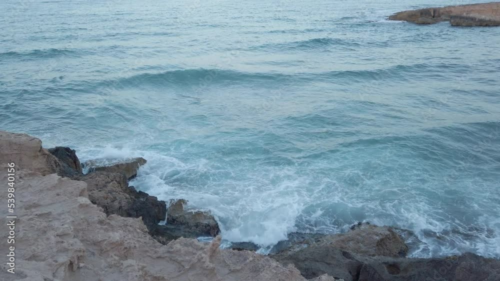 Waves hitting rocks on the shore in Spain 2 Waves hitting rocks on the shore in Spain 2