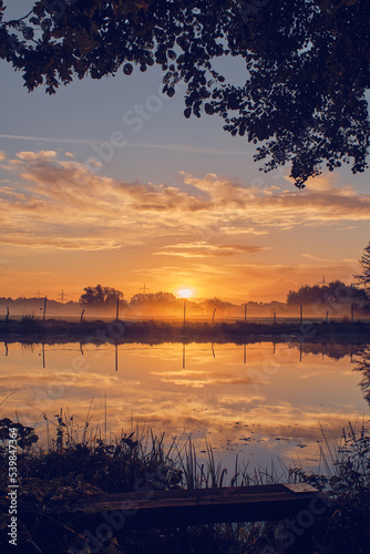 Reflection on pond in sunrise. High quality photo