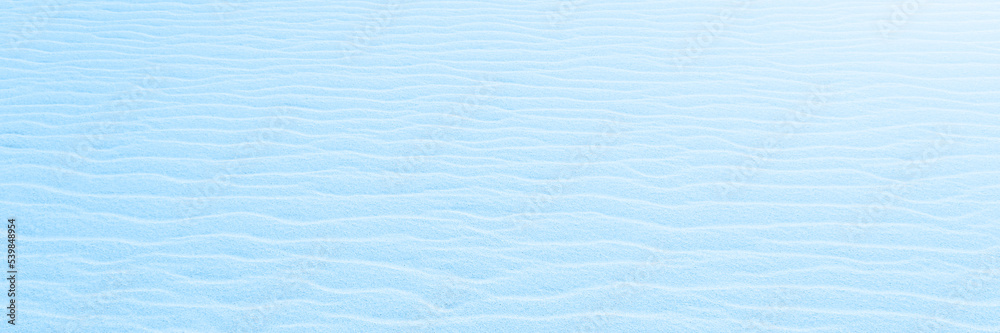 Close up on Beach Sand texture background for wallpaper and poster. Sandy beach texture toned in blue. Side Top view. Long banner. Close up on Beach Sand texture background for wallpaper and poster. Sandy beach texture toned in blue. Side Top view. Long banner.
