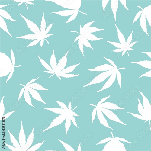 Seamless pattern of cannabis leaves on a blue background. White hemp leaves on a blue background. 