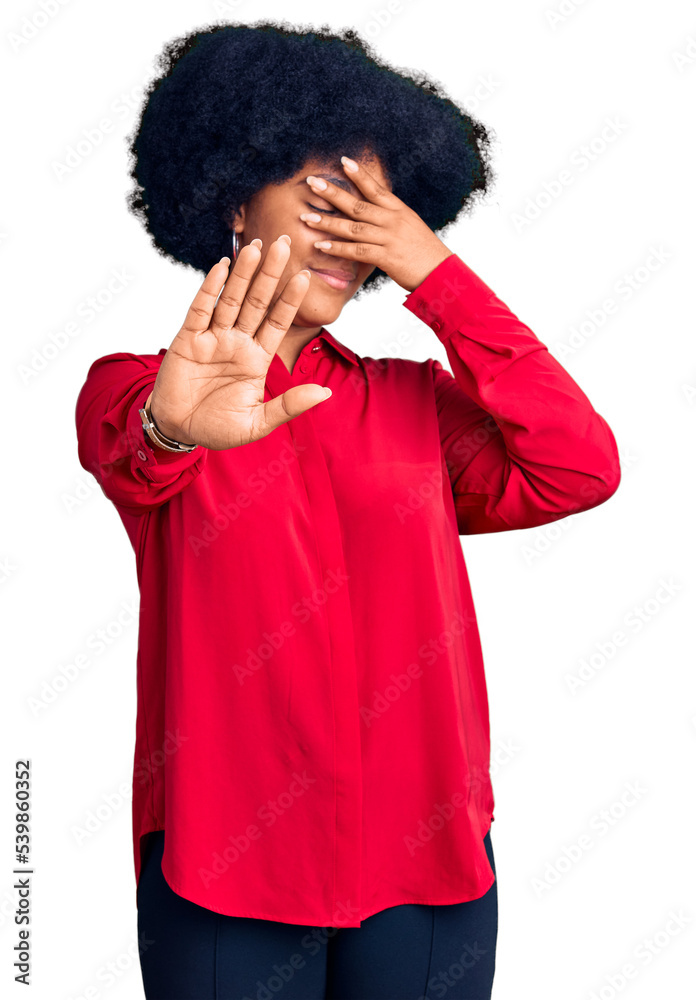 Young african american girl wearing casual clothes covering eyes with hands and doing stop gesture with sad and fear expression. embarrassed and negative concept.