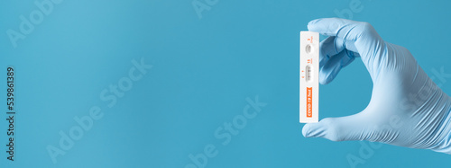 Fotografie Hand is showing positive results on rapid antigen test kit for covid-19