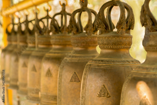 Blurred image of hanging bells on the background.