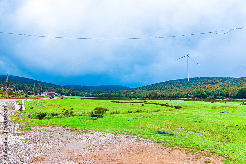 Houses using clean wind turbine energy electric cable and electricity on the plateau. Houses using clean wind turbine energy electric cable and electricity on the plateau.