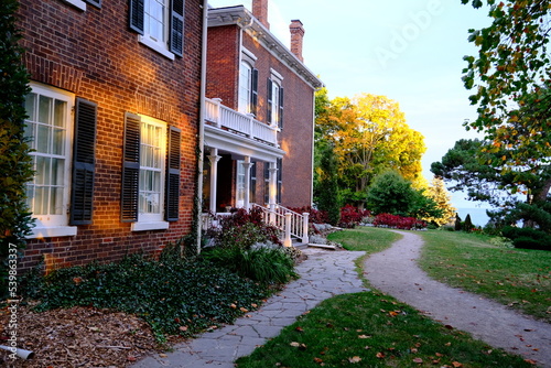 Historic building  shuttered windows and part of the park