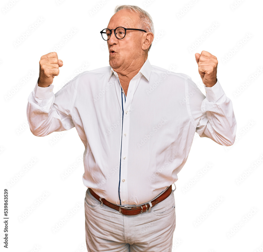 Senior caucasian man wearing business shirt and glasses showing arms muscles smiling proud. fitness concept. Senior caucasian man wearing business shirt and glasses showing arms muscles smiling proud. fitness concept.