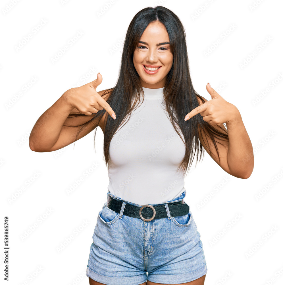 Young beautiful hispanic girl wearing casual clothes looking confident with smile on face, pointing oneself with fingers proud and happy. Young beautiful hispanic girl wearing casual clothes looking confident with smile on face, pointing oneself with fingers proud and happy.