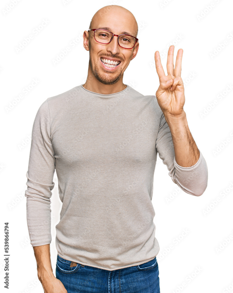 Bald man with beard wearing casual clothes and glasses showing and pointing up with fingers number three while smiling confident and happy. Bald man with beard wearing casual clothes and glasses showing and pointing up with fingers number three while smiling confident and happy.