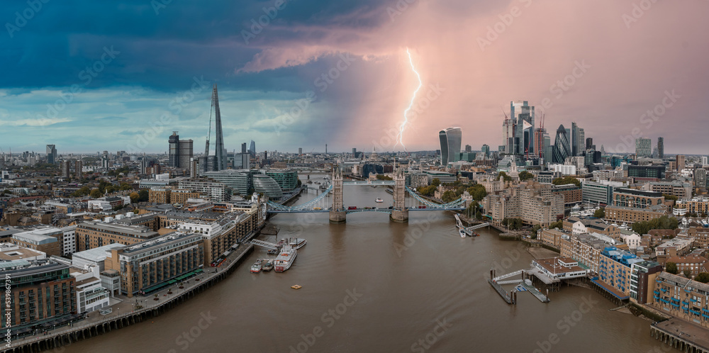 Lightening and thunderstorm in the middle of London near the Tower bridge in London.