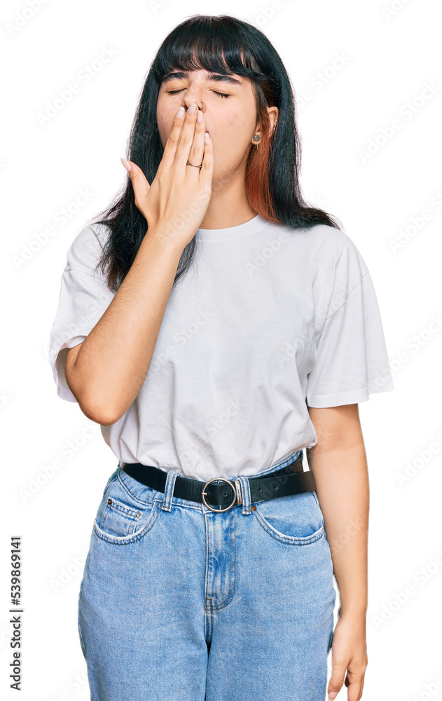 Young hispanic girl wearing casual clothes bored yawning tired covering mouth with hand. restless and sleepiness. Young hispanic girl wearing casual clothes bored yawning tired covering mouth with hand. restless and sleepiness.