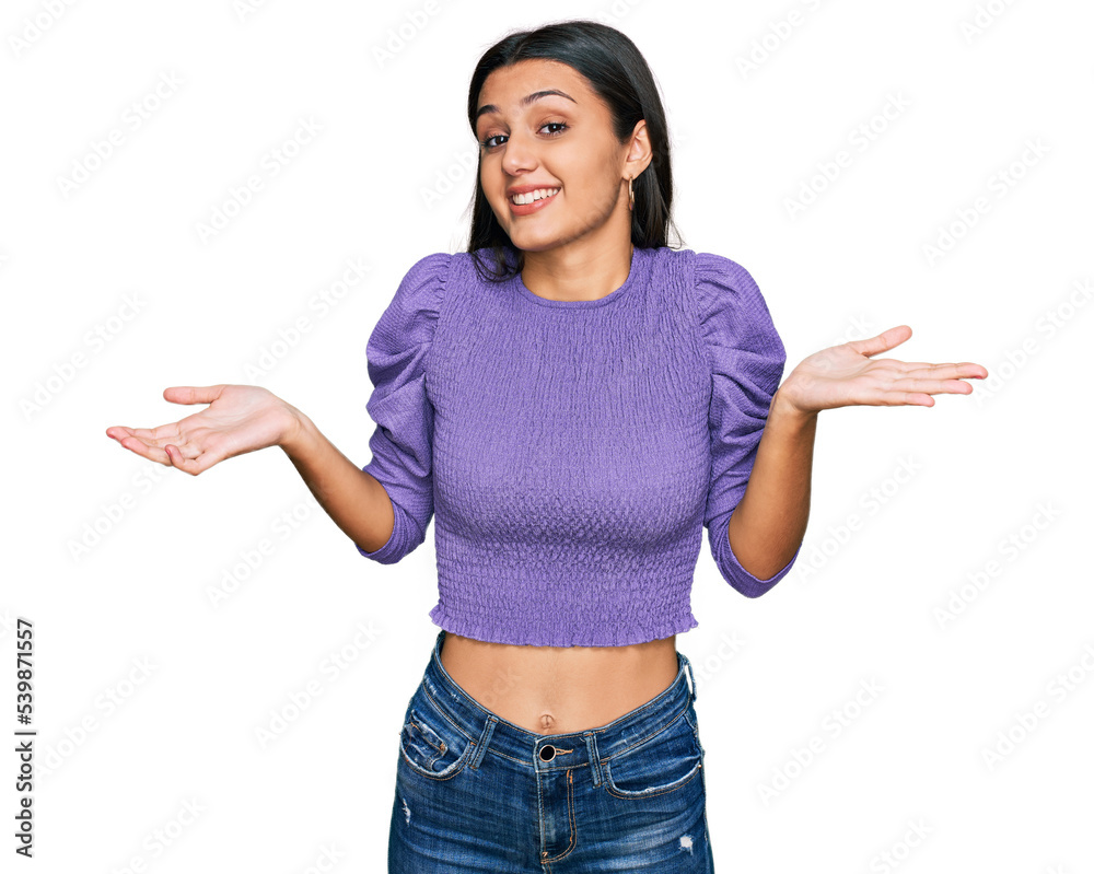 Young hispanic girl wearing casual clothes clueless and confused expression with arms and hands raised. doubt concept. Young hispanic girl wearing casual clothes clueless and confused expression with arms and hands raised. doubt concept.