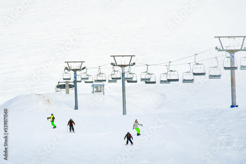 Fotografie Gudauri, Georgia - 25th february, 2022: group of kids in ski snowboard on slope