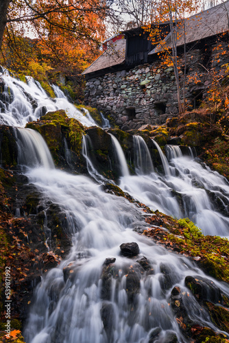 Beautiful waterfall in autumn forest in Jonkoping  Sweden. Long exposure. 