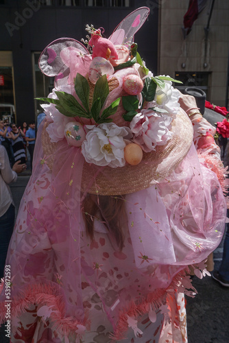 New York, New York: A woman wearing an elaborate Easter bonnet, with colored eggs, flowers, and butterflies, at the annual Fifth Avenue Easter Parade.