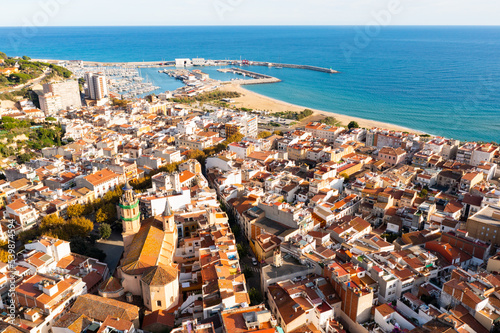View over the town, the beach and the fishing harbor of Arenys de Mar. on the mediterranean coast near Barcelona photo