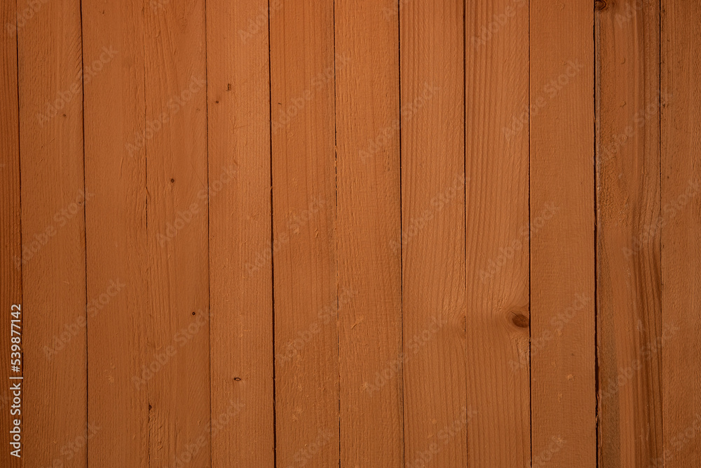 Fototapeta premium Thin wooden slats patterned background stained in a golden oak color