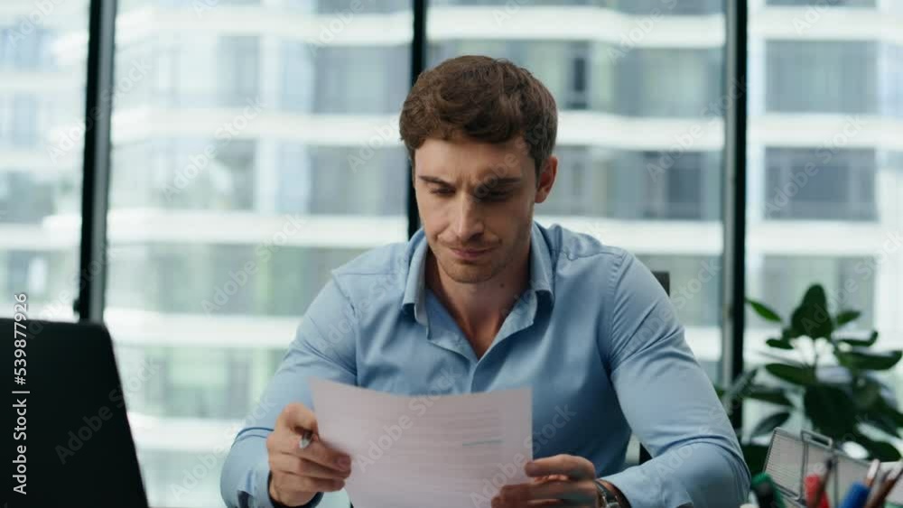 Man entrepreneur feeling exhausted working at office desk with laptop close up Man entrepreneur feeling exhausted working at office desk with laptop close up