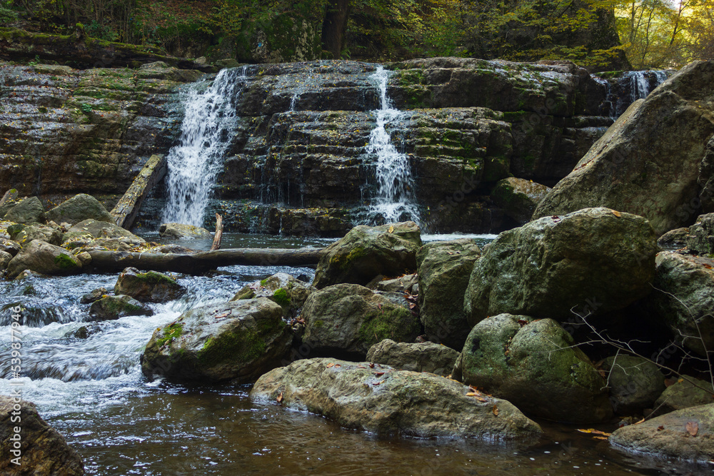 active waterfall in the mountains active waterfall in the mountains