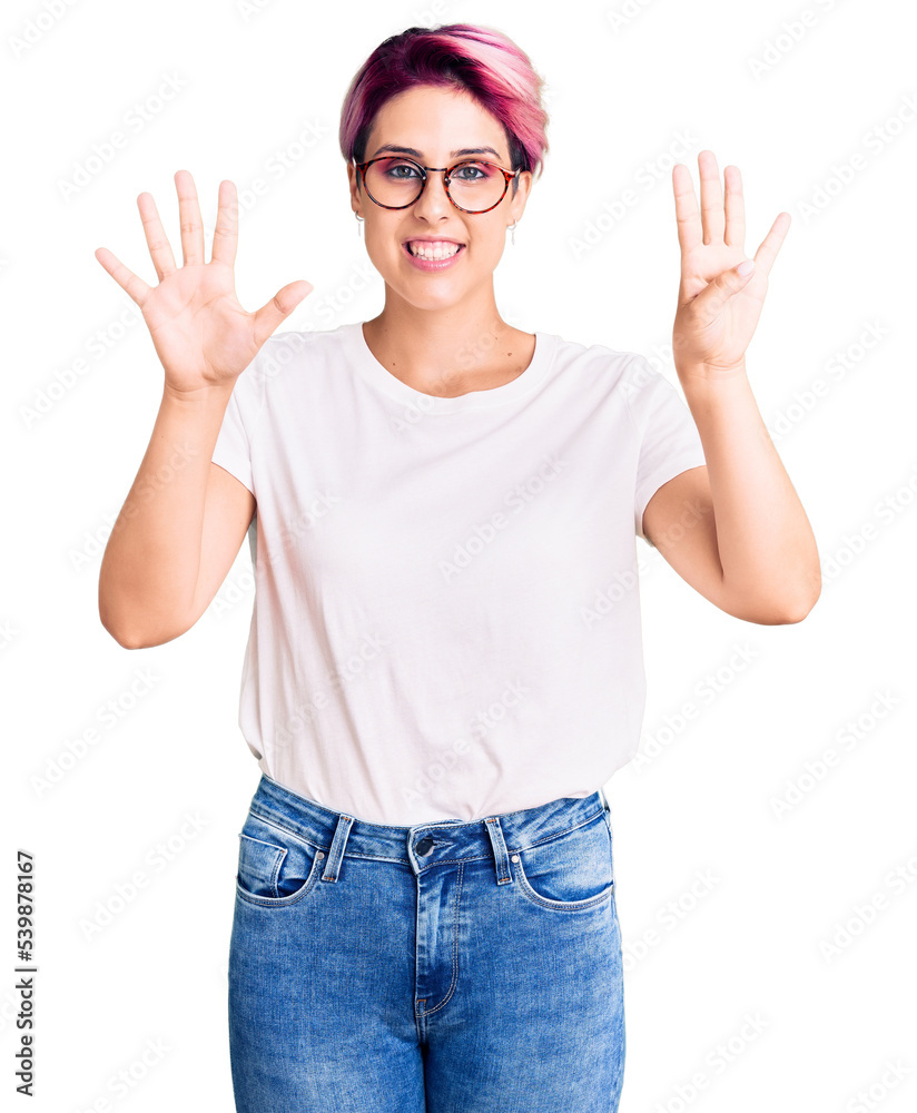 Young beautiful woman with pink hair wearing casual clothes and glasses showing and pointing up with fingers number nine while smiling confident and happy. Young beautiful woman with pink hair wearing casual clothes and glasses showing and pointing up with fingers number nine while smiling confident and happy.