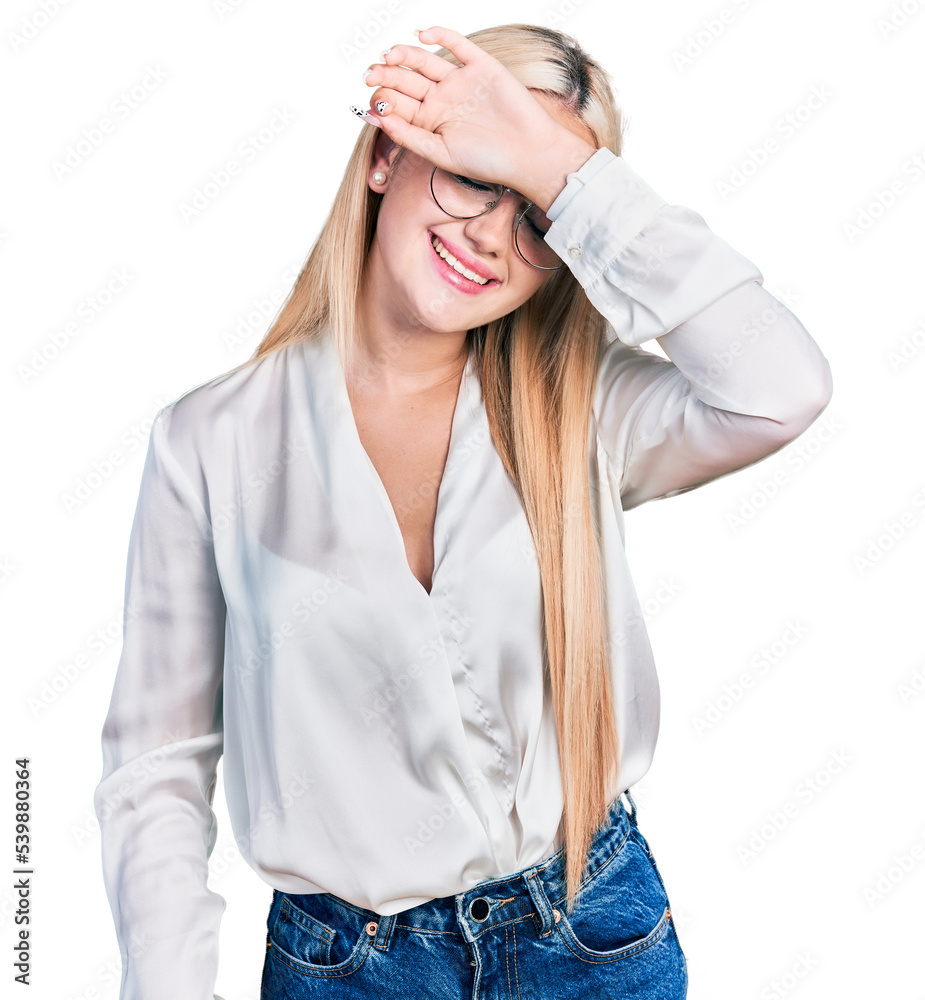 Beautiful blonde woman wearing elegant shirt and glasses covering eyes with arm smiling cheerful and funny. blind concept. Beautiful blonde woman wearing elegant shirt and glasses covering eyes with arm smiling cheerful and funny. blind concept.