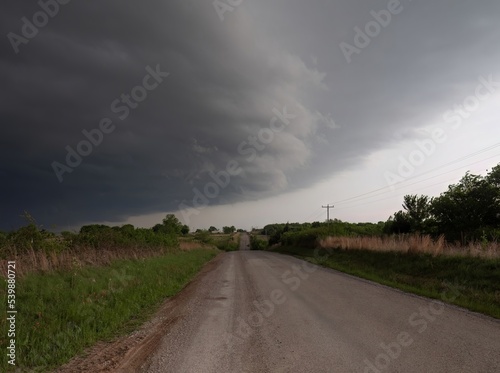 Rural Gravel Road with Gray Clouds Overhead