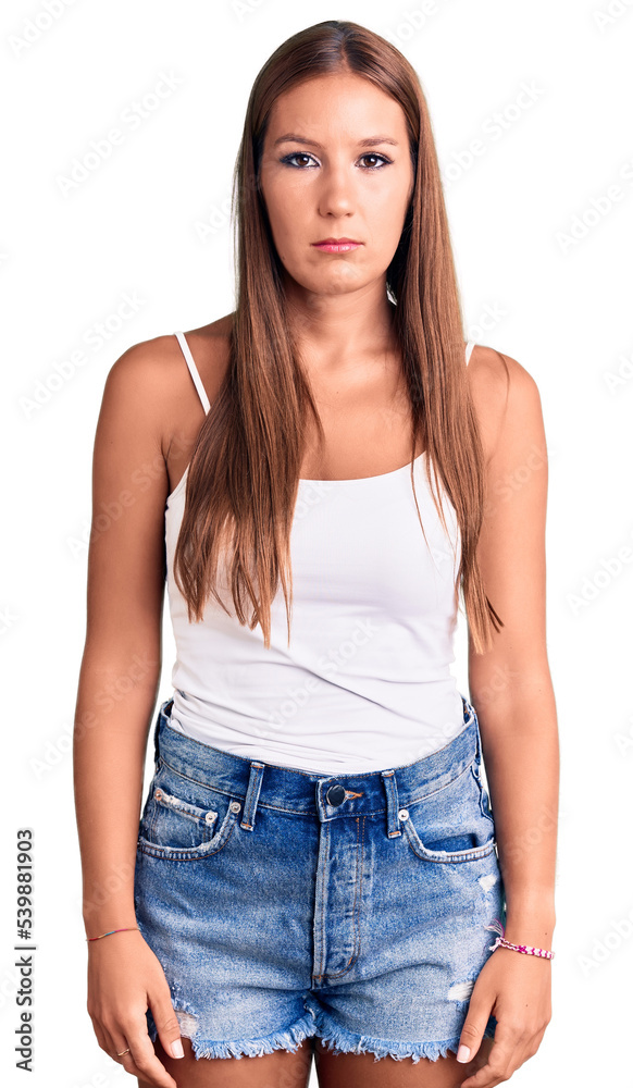 Obraz premium Young beautiful hispanic woman wearing casual clothes with serious expression on face. simple and natural looking at the camera.