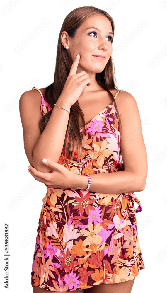 Young beautiful hispanic woman wearing casual clothes with hand on chin thinking about question, pensive expression. smiling and thoughtful face. doubt concept. Young beautiful hispanic woman wearing casual clothes with hand on chin thinking about question, pensive expression. smiling and thoughtful face. doubt concept.