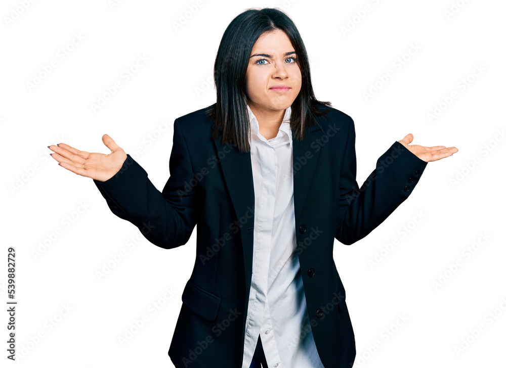 Young brunette woman with blue eyes wearing business jacket clueless and confused with open arms, no idea and doubtful face. Young brunette woman with blue eyes wearing business jacket clueless and confused with open arms, no idea and doubtful face.