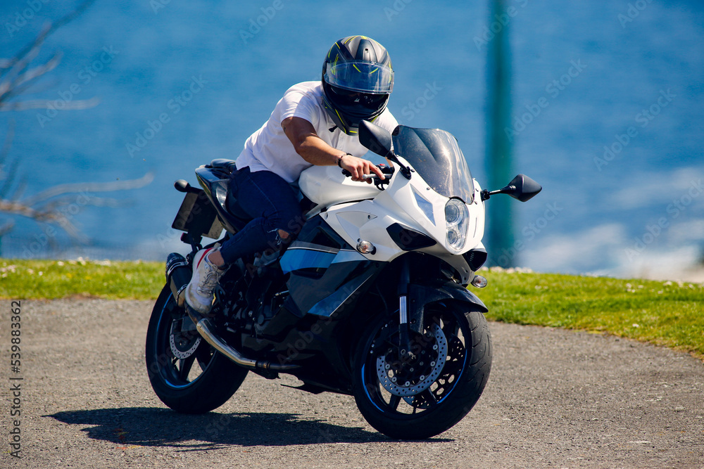 motorcycle on the road driving fast. have fun on the empty road on a motorcycle trip. copy space for individual text. motorcycle on the road driving fast. have fun on the empty road on a motorcycle trip. copy space for individual text.