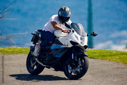 motorcycle on the road driving fast. have fun on the empty road on a motorcycle trip. copy space for individual text.