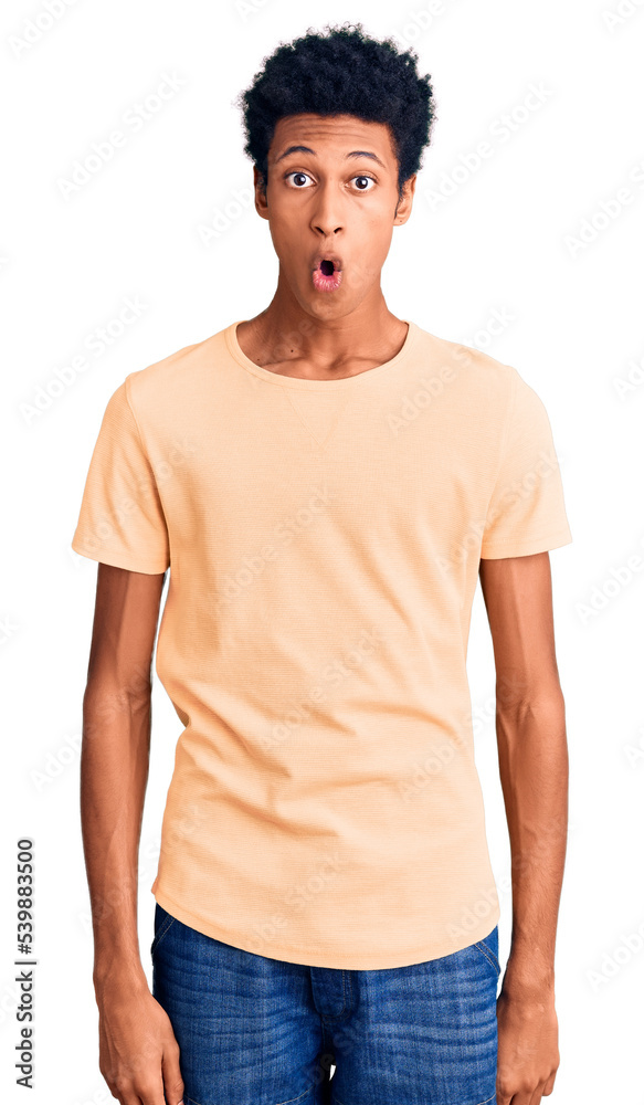 Young african american man wearing casual clothes afraid and shocked with surprise expression, fear and excited face. Young african american man wearing casual clothes afraid and shocked with surprise expression, fear and excited face.