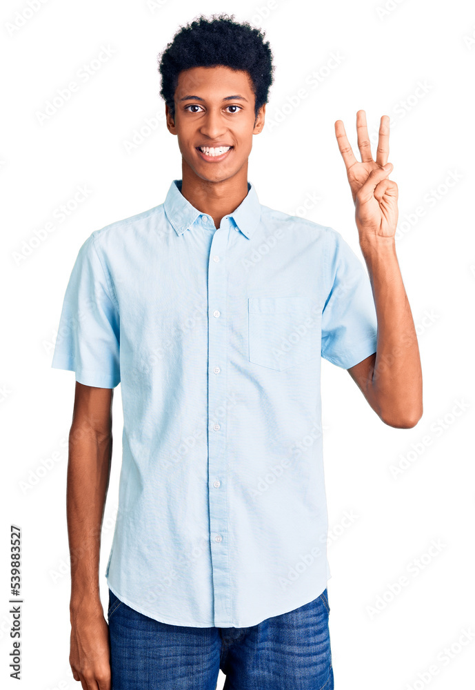 Young african american man wearing casual clothes showing and pointing up with fingers number three while smiling confident and happy. Young african american man wearing casual clothes showing and pointing up with fingers number three while smiling confident and happy.