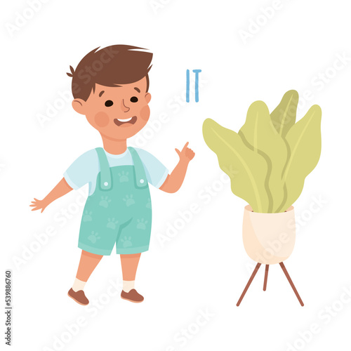 English Subject Pronoun with Funny Boy Demonstrating It Word Indicating Flower in Pot Vector Illustration