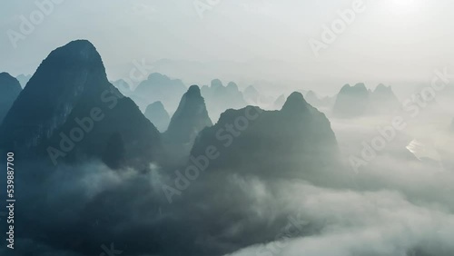 Aerial footage of Beautiful mountain with fog natural landscape at sunrise in Guilin, China. 