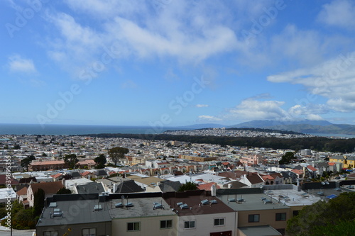 Photography View over several western neighborhoods in San Francisco, including Golden Gate Park, with the Pacific Ocean visible in the background