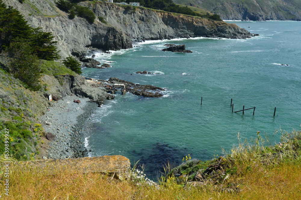 Black sand beach and blue-green water looking down the cliffs along the Pacific coast north of San Francisco. Black sand beach and blue-green water looking down the cliffs along the Pacific coast north of San Francisco.
