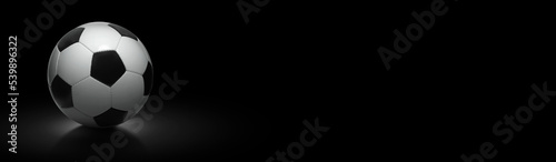 Soccer ball on black background  wide image