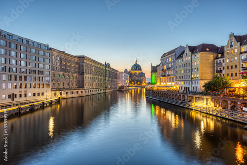 The river Spree in Berlin with the Nicolaiviertel and the Cathedral after sunset © elxeneize