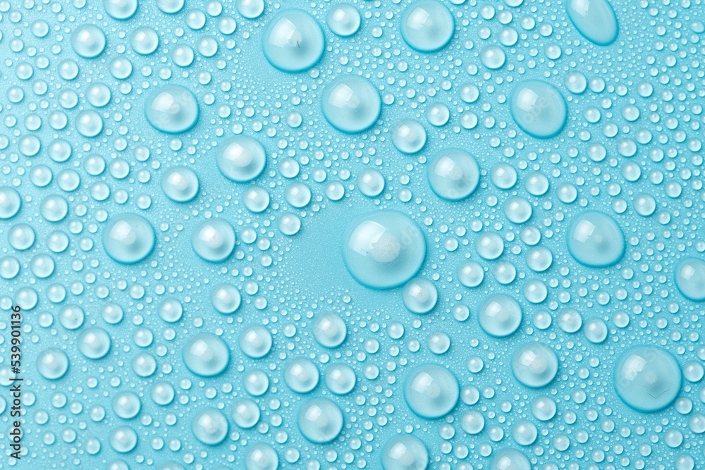 Water drops on a blue background close-up
