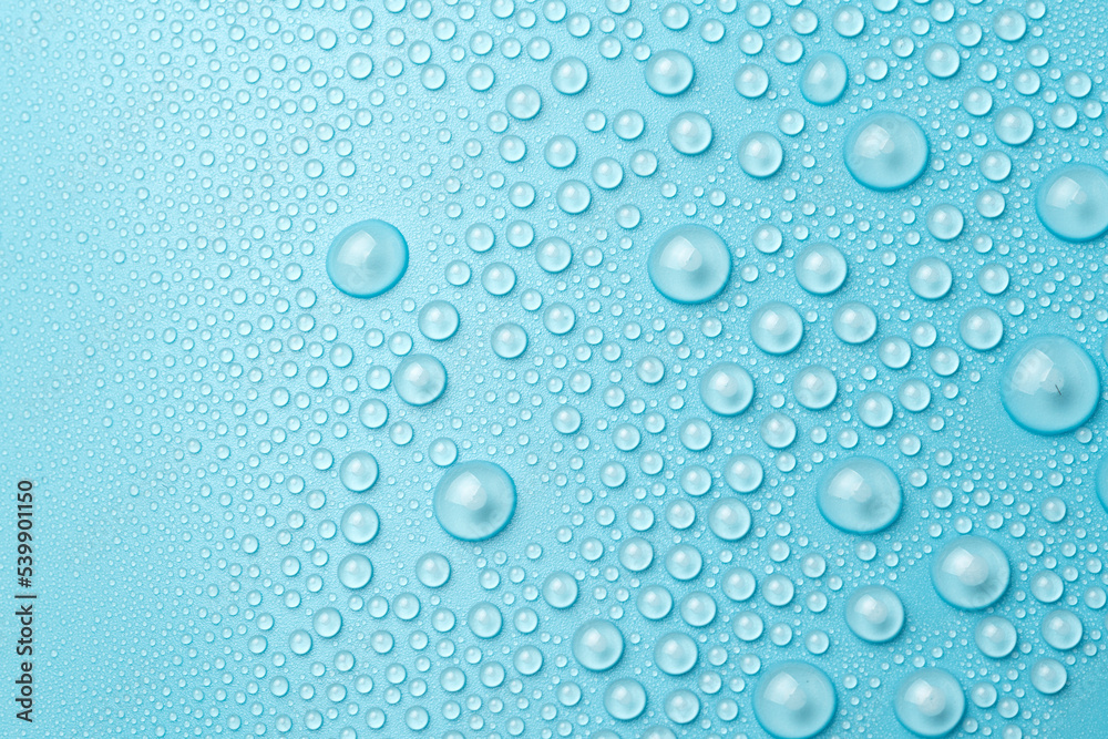 Water drops on a blue background close-up