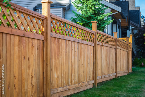 Print op canvas Nice new wooden fence around house