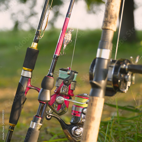 Spinning rods with reels and lures ready for fishing
