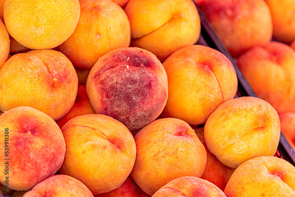 ripe peaches on store shelf closeup view ripe peaches on store shelf closeup view